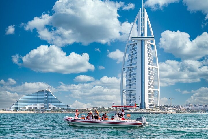 Glide through the stunning Dubai Marina taking in the impressive Burj Al Arab and sandy shores creating unforgettable moments with loved ones against an iconic skyline.